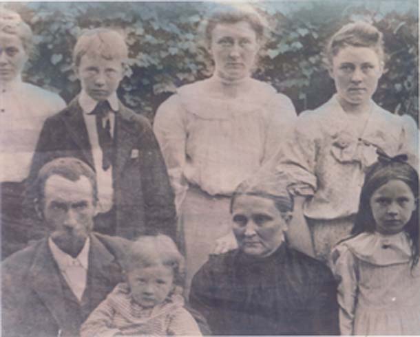 Charles Franklin Faulkner and Rosa Faulkner are seated in front.
Sidney Franklin Faulkner is the boy standing on back row.
Anne Let Faulkner is the tallest woman standing to the right of Sidney.
Can anyone identify the others?