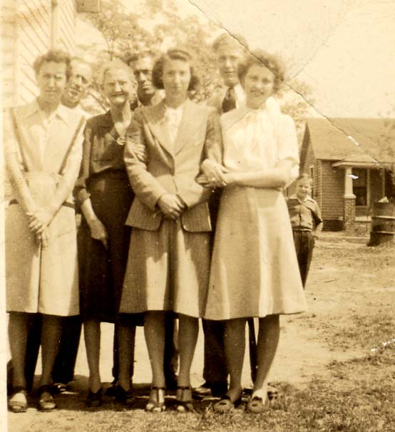 Left to Right: Virginia Raines Peoples, Herman Raines, Tellie Raines,
Andrew Raines, Lillie Mae Raines Ellington, Robert Raines, Lucille Raines Crocker