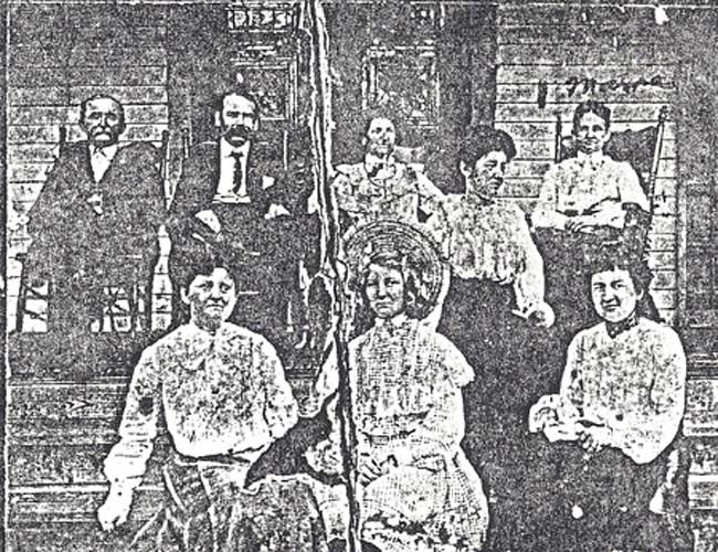 John B. Slater rear left with family members. His wife Annie Davis Slater is on bottom row third from the left. John's brother Jesse D. Slater is sitting next to him and the lady next to Jesse may be Jesse's wife. The girl with the hat is believed to be Jesse's daughter.